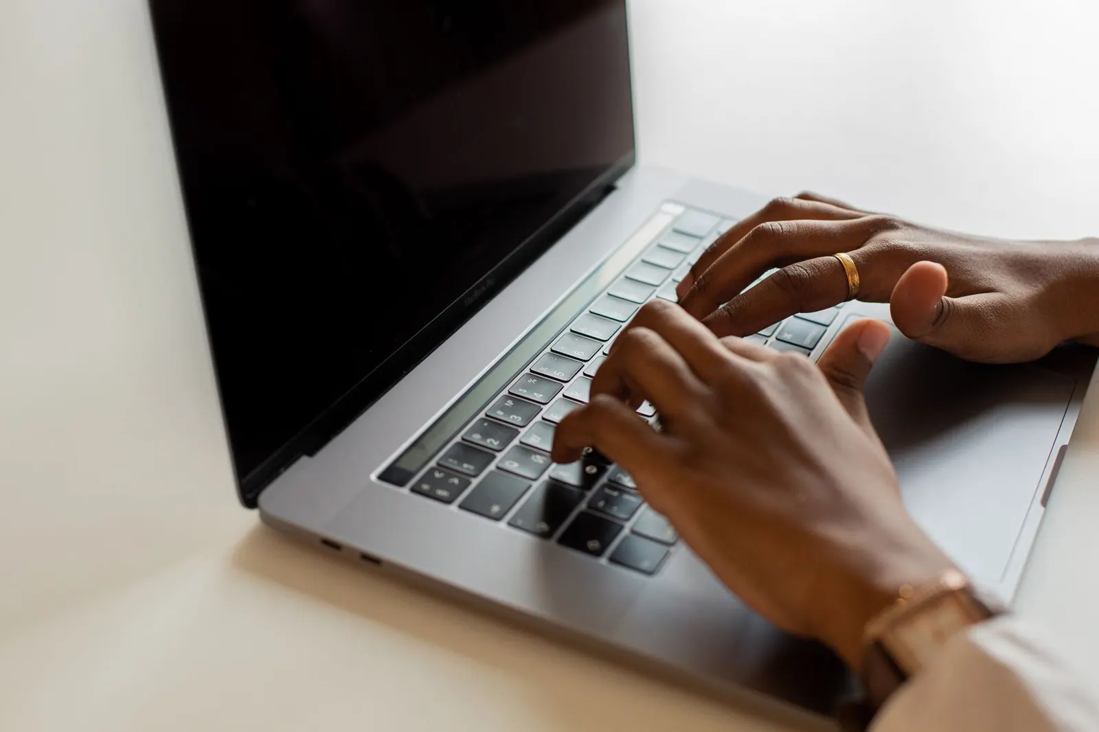 Hands typing on a laptop keyboard during a work session, showcasing modern connectivity. B2B SEO lead generation: the metrics that matter to sales, not just visits