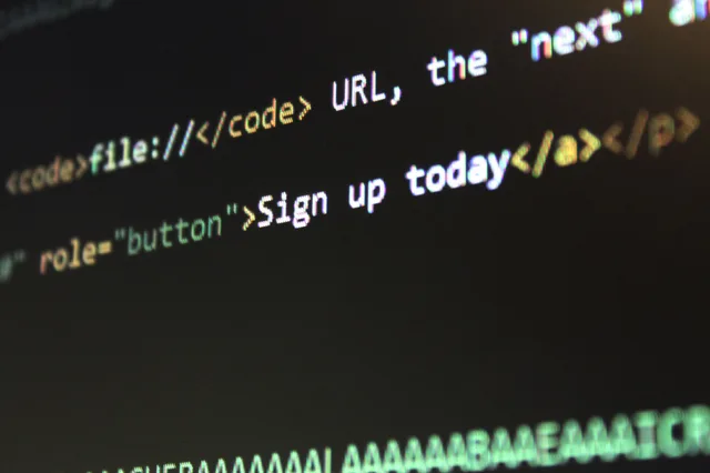 Detailed view of HTML and CSS code on a computer screen, concept of programming. Nine Enterprise SEO Examples and the Test to Run on Each