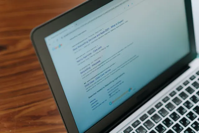 A close-up view of a laptop displaying a search engine page. Keyword research explained for business teams