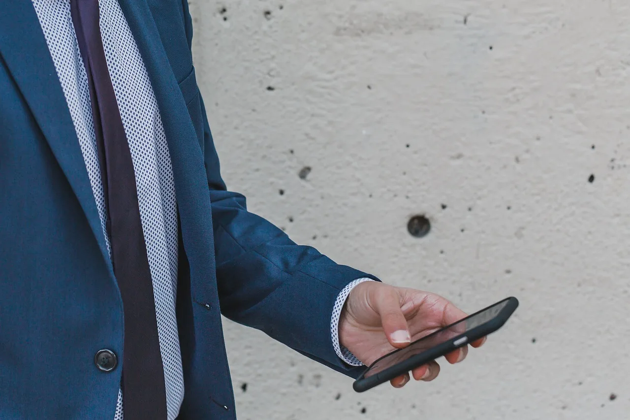 people, business, man, formal, wall, infrastructure, building, establishment, work, mobile, phone, gray business, gray work, gray phone, gray building, gray mobile, gray wall, gray company, gray businessman, gray smartphone, gray telephone. Building real authority in local SEO: location data, reviews, and trust