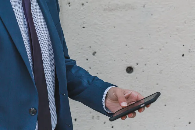 people, business, man, formal, wall, infrastructure, building, establishment, work, mobile, phone, gray business, gray work, gray phone, gray building, gray mobile, gray wall, gray company, gray businessman, gray smartphone, gray telephone. Building real authority in local SEO: location data, reviews, and trust