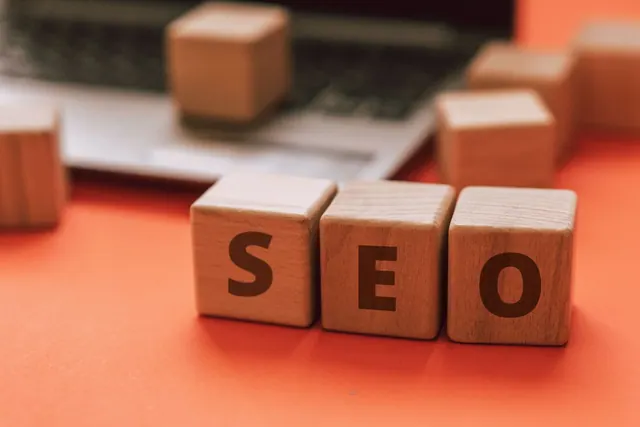 Wooden blocks spelling SEO on a laptop keyboard convey digital marketing concepts. SEO strategy patterns worth adapting, from ecommerce recovery to migrations