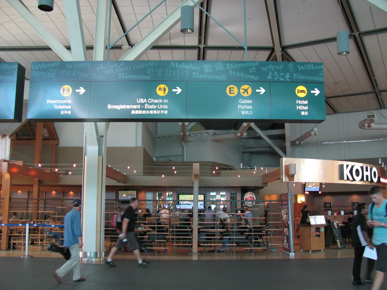 Multilingual welcome signage at Vancouver International Airport.